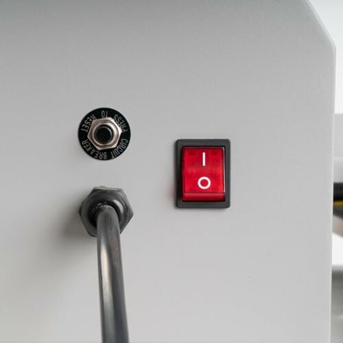 Red power switch and cable on industrial device